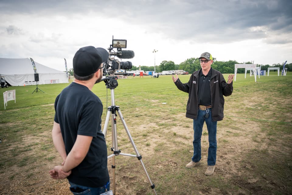 Filming an on-camera interview at an outdoor event